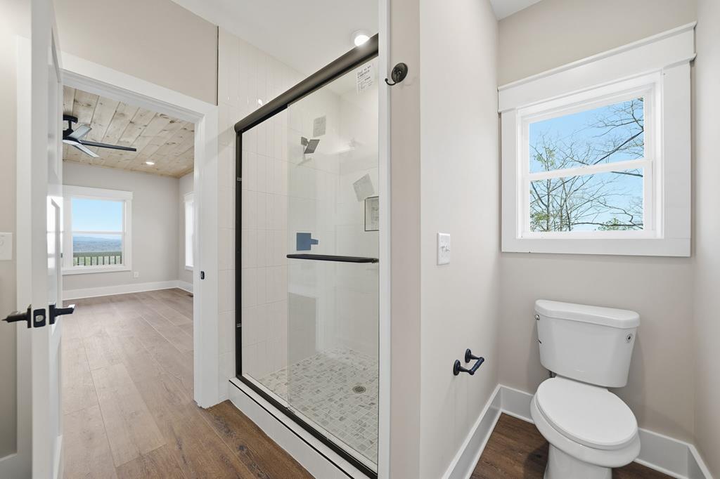 1176 Jewel Court Northeast Ranger, GA 30734 - Photo 26 of 57 a bathroom with a toilet and a shower