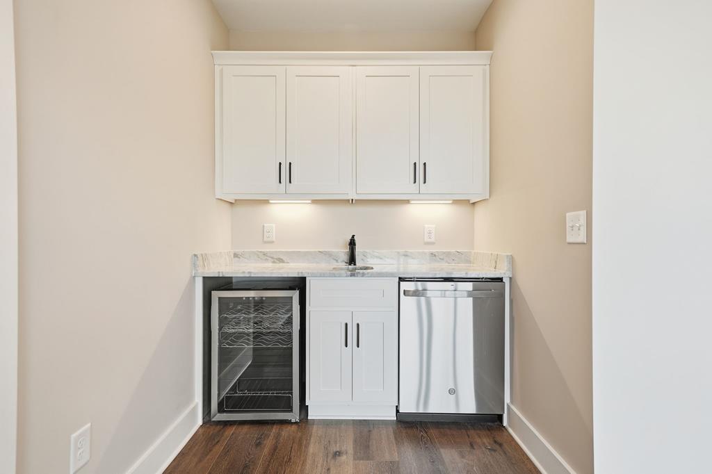 1176 Jewel Court Northeast Ranger, GA 30734 - Photo 35 of 57 a kitchen with granite countertop white cabinets and white appliances