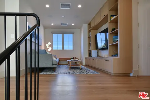 a living room with furniture and a rug