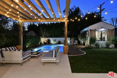 a view of swimming pool with patio