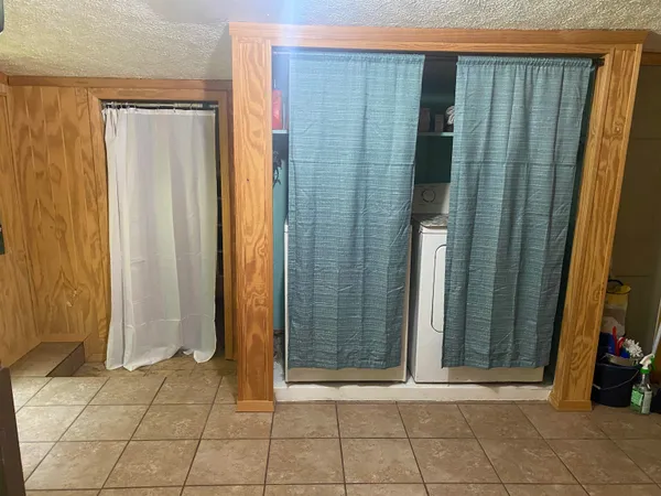 a view of an entryway with a door