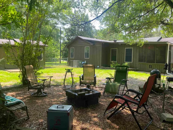 a backyard of a house with lots of green space