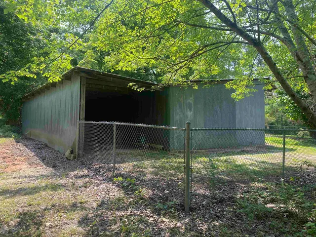 a view of backyard with green space