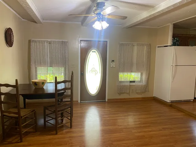a kitchen with a refrigerator and sink
