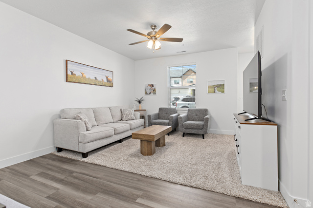 4735 Alder Drive, Unit F101 Mapleton, UT 84664 - Photo 6 of 30 Living room with light wood-style floors and ceiling fan