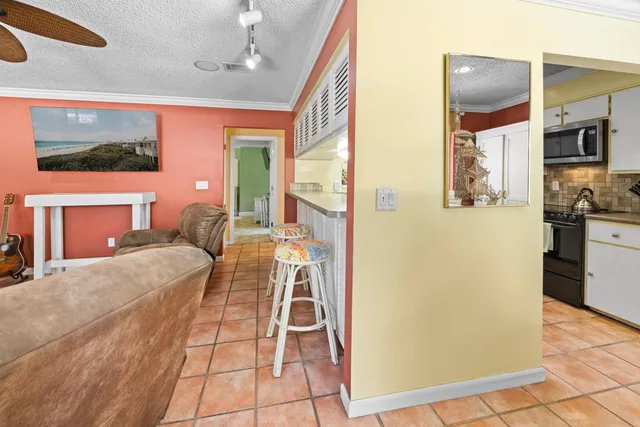 a bedroom with a bed and a mirror on the wall