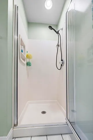 a bathroom with a bathtub and a shower