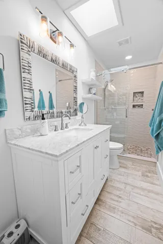 a bathroom with a double vanity sink and a mirror