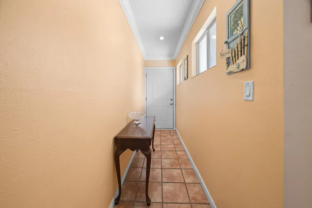 a view of swimming pool with outdoor seating and a garden