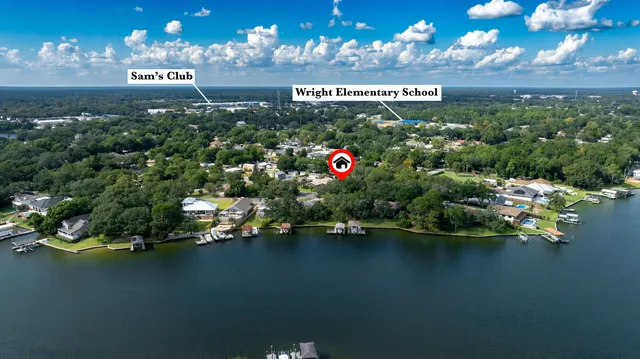 an aerial view of multiple houses with yard