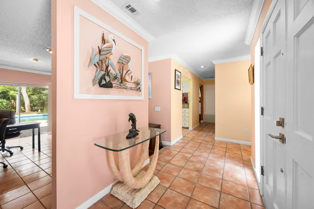 a view of a living room and a stove in a room
