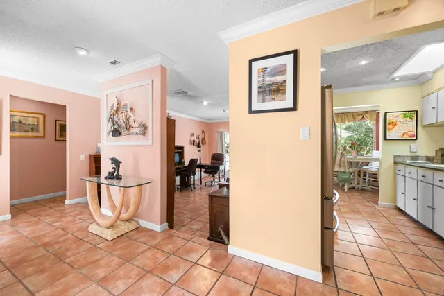a living room with furniture windows and a flat screen tv