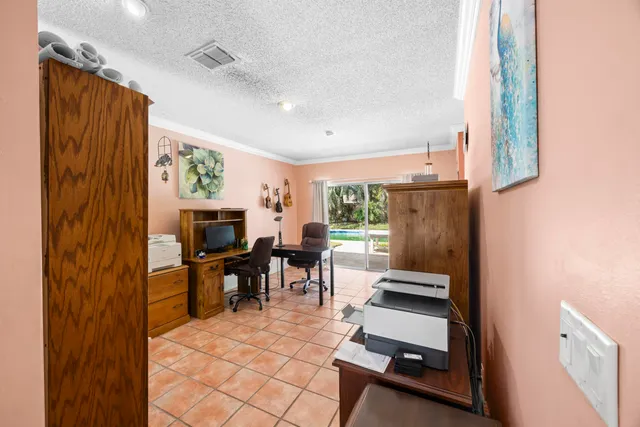 a view of a workspace with furniture