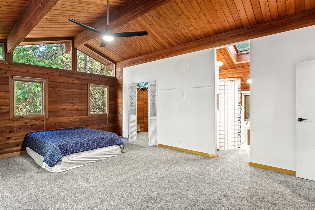 14969 Centerville Road Magalia, CA 95954 - Photo 25 of 75 a living room with a bed and a dresser next to a window