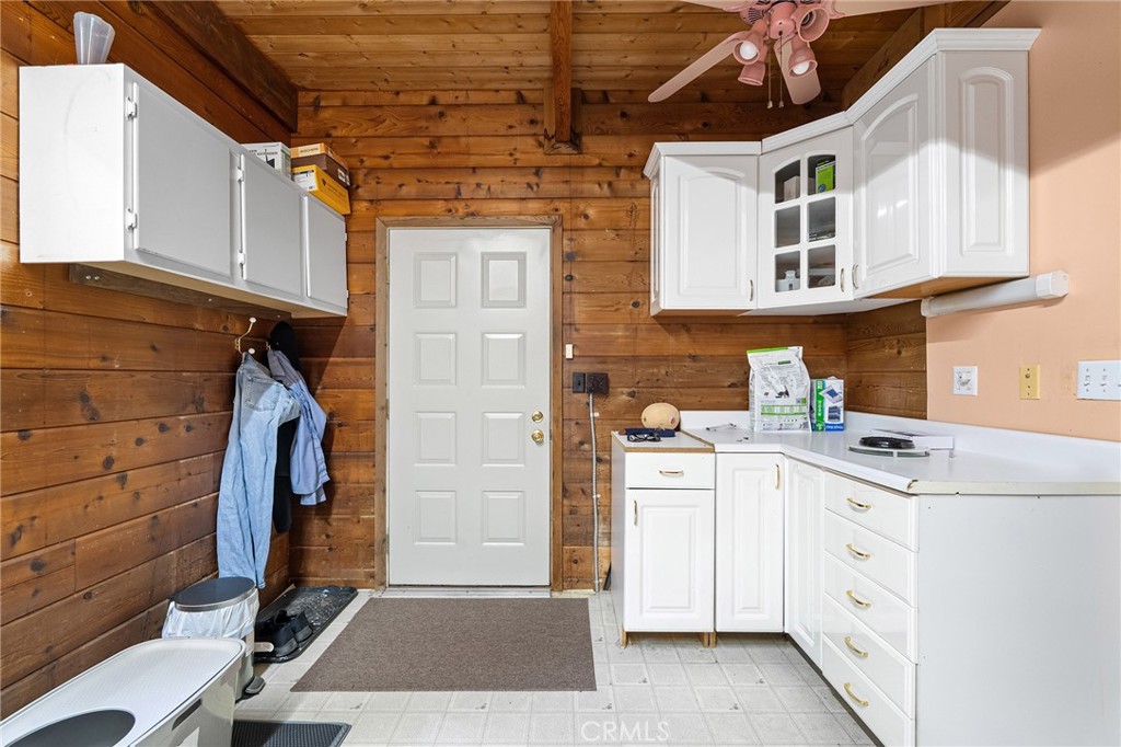 14969 Centerville Road Magalia, CA 95954 - Photo 38 of 75 a utility room with cabinets washer and dryer