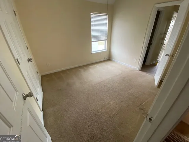 a view of empty room with front door