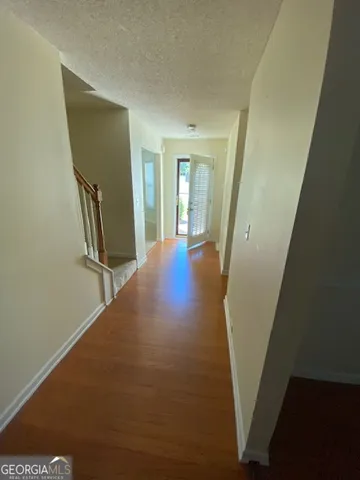 a view of a hallway with front door