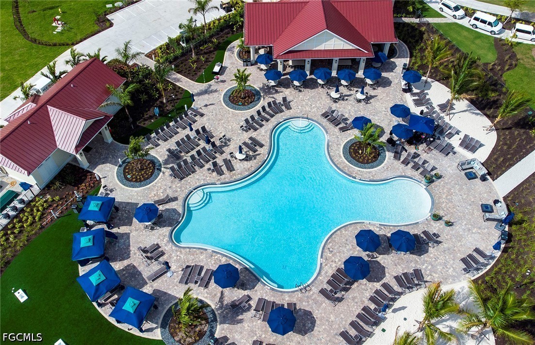 16969 Oakstead Drive Alva, FL 33920 - Photo 15 of 20 an aerial view of a swimming pool patio and outdoor seating
