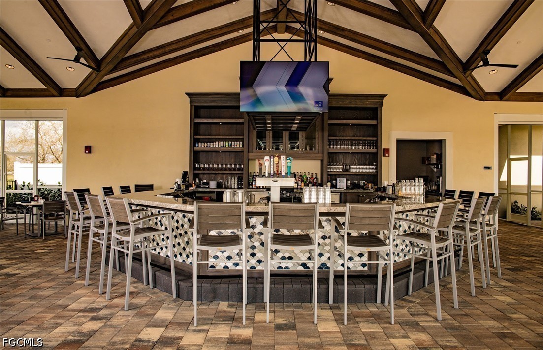 16969 Oakstead Drive Alva, FL 33920 - Photo 17 of 20 a dinning table and chairs in front of a building