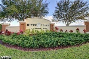 16969 Oakstead Drive Alva, FL 33920 - Photo 6 of 20 a sign of golf club on a wall under a tree
