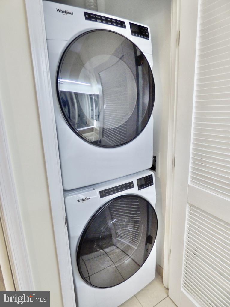 11800 Sunset Hills Road, Unit 118 Reston, VA 20190 - Photo 23 of 52 Sleek stacked laundry appliances.