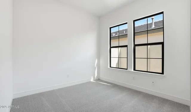 a view of an empty room with glass door