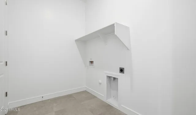 a white bath tub sitting next to a bathroom sink