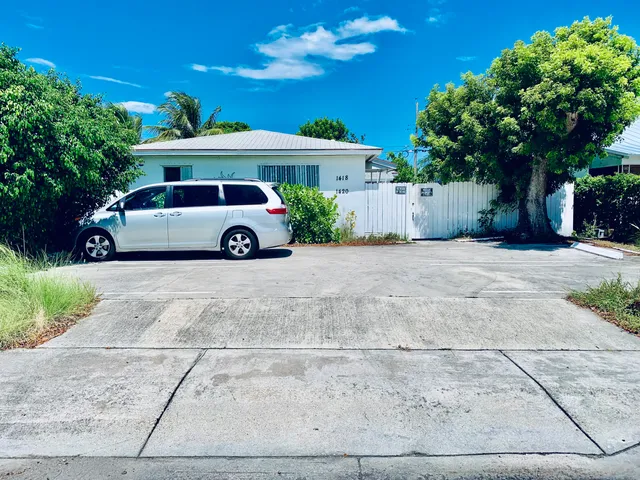 a car parked in front of a house