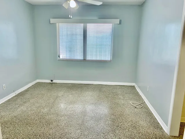 an empty room with a empty space and a window