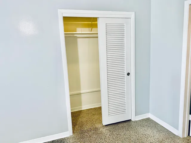 a view of a room that has a window