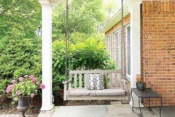 a flower garden is sitting in front of a house