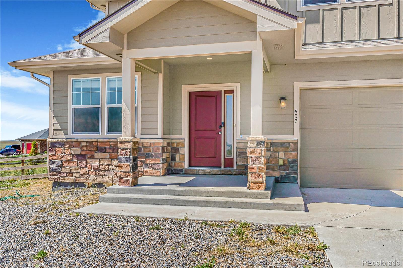 497 Valley Way Bennett, CO 80102 - Photo 2 of 37 front view of a house with a yard
