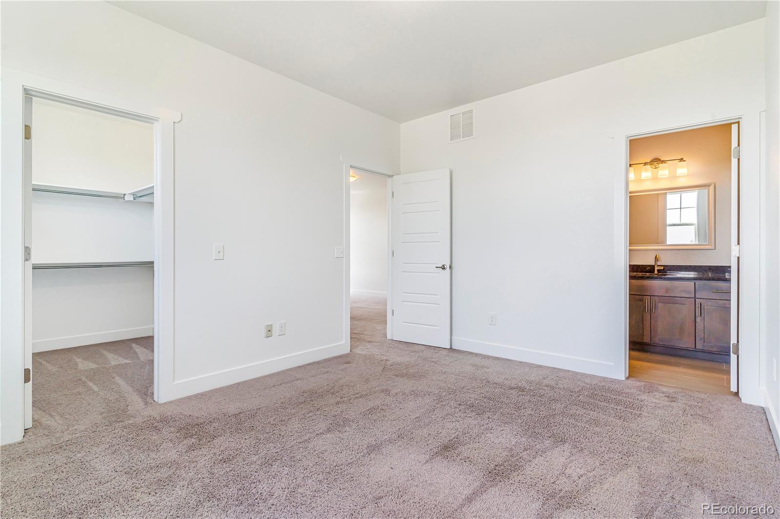 497 Valley Way Bennett, CO 80102 - Photo 23 of 37 a view of an empty room with a kitchen