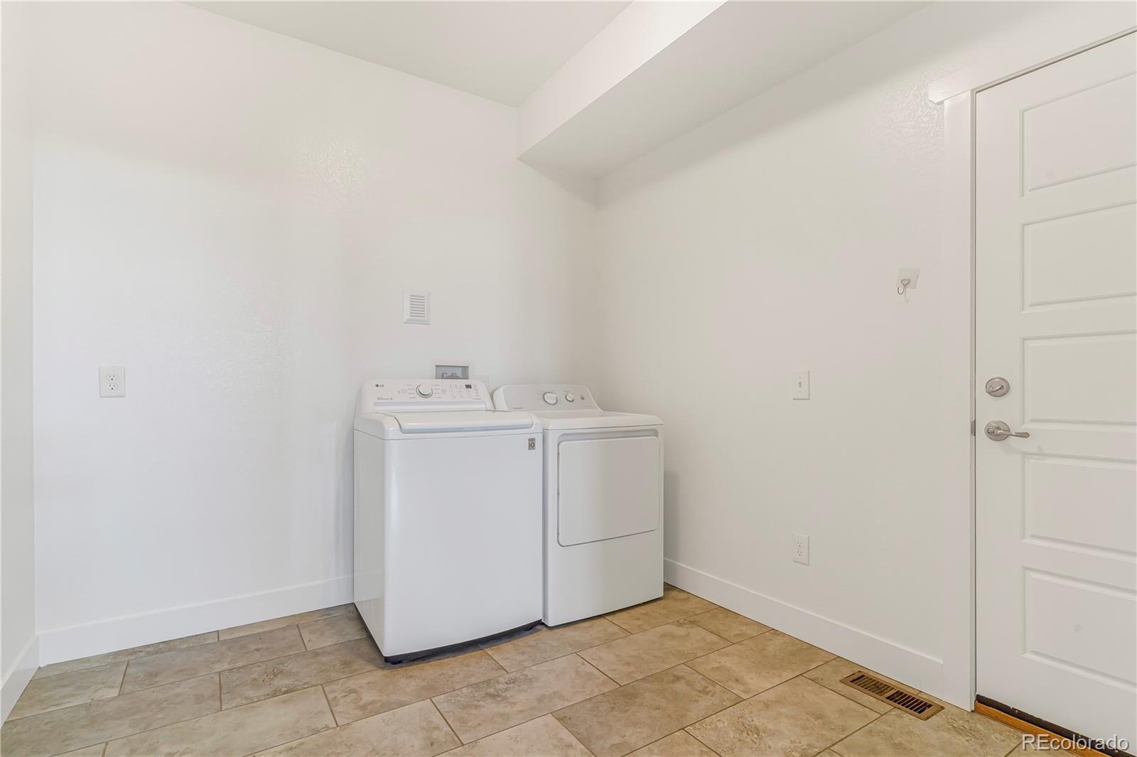 497 Valley Way Bennett, CO 80102 - Photo 29 of 37 a utility room with a sink