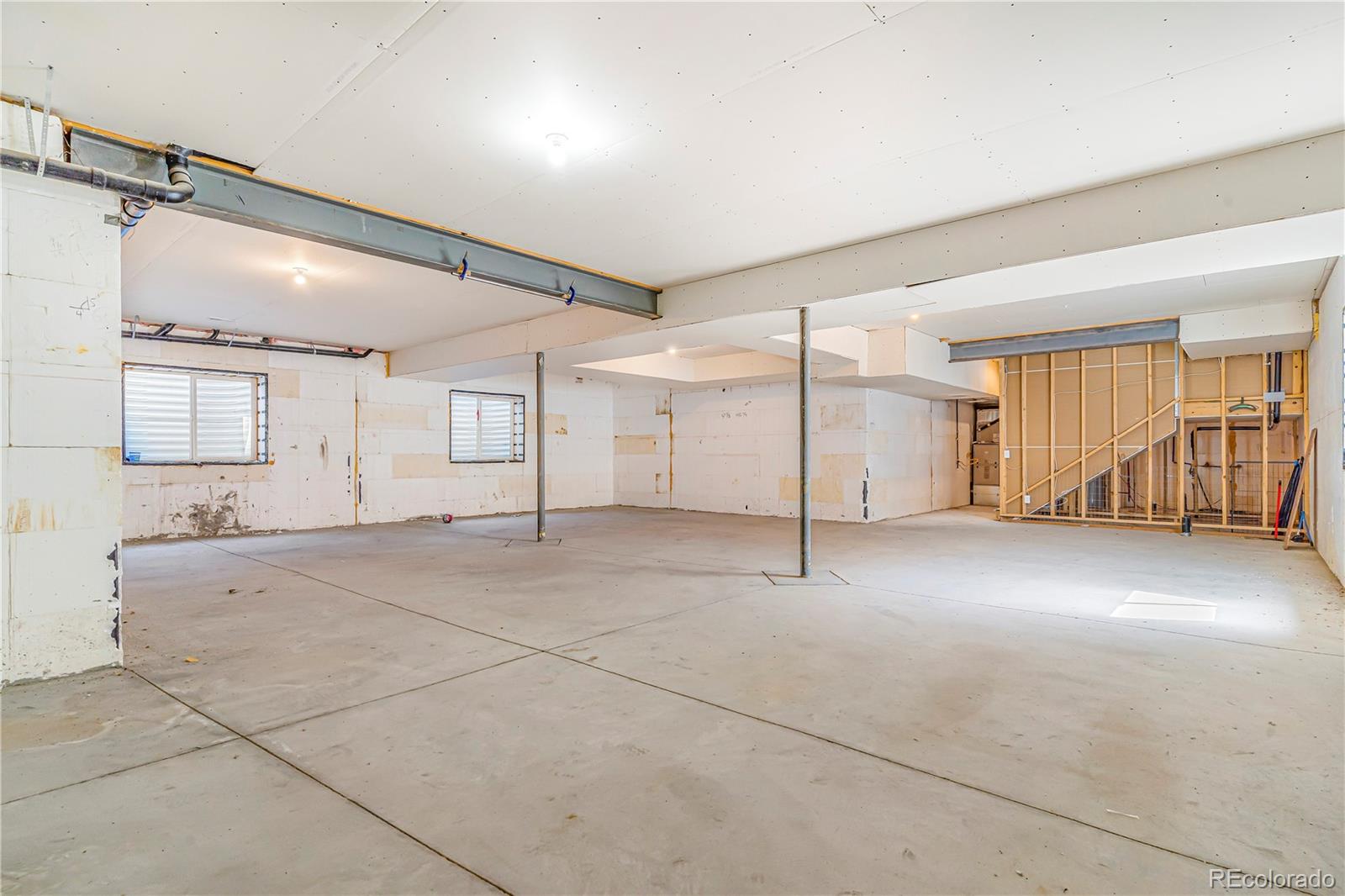 497 Valley Way Bennett, CO 80102 - Photo 32 of 37 a view of a livingroom with a staircase