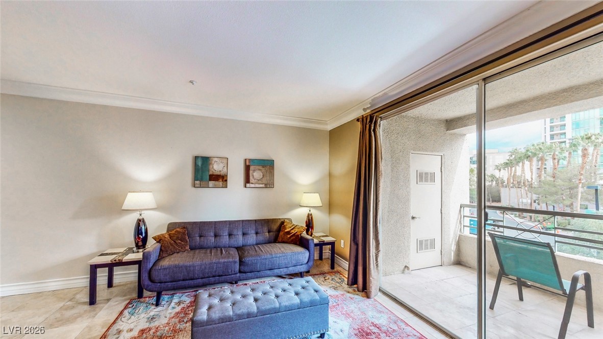 260 East Flamingo Road, Unit 229 Las Vegas, NV 89169 - Photo 30 of 31 Living area with ornamental molding and baseboards
