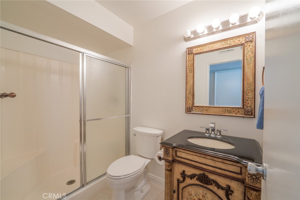 45 Oval Irvine, CA 92604 - Photo 12 of 40 a bathroom with a sink a toilet and a mirror