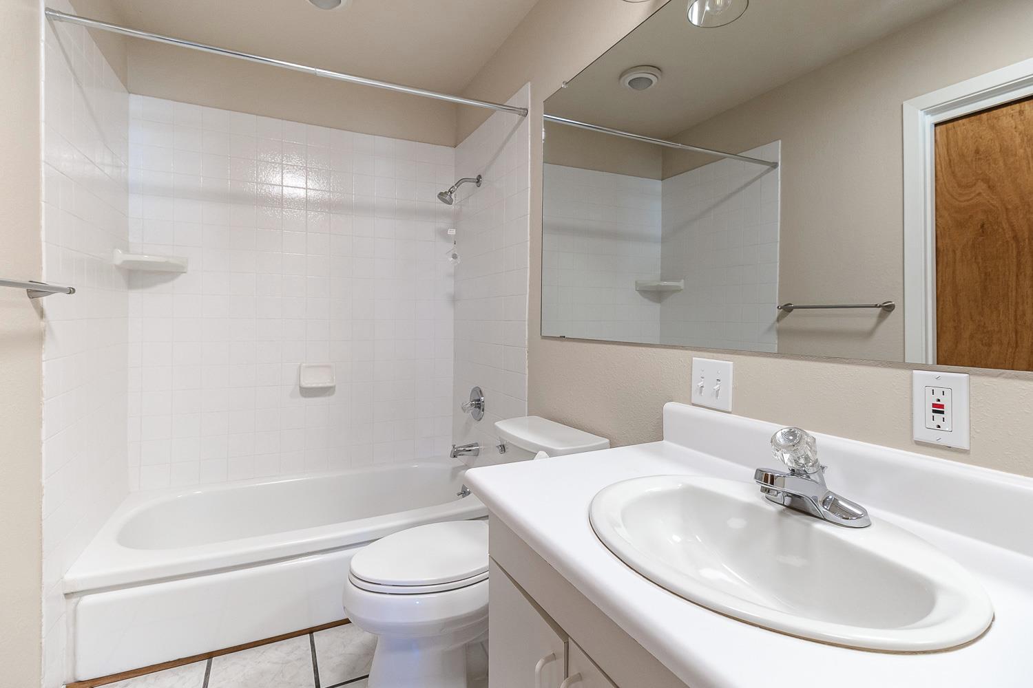 1506 Madison Avenue Tracy, CA 95376 - Photo 13 of 21 a bathroom with a sink toilet and shower