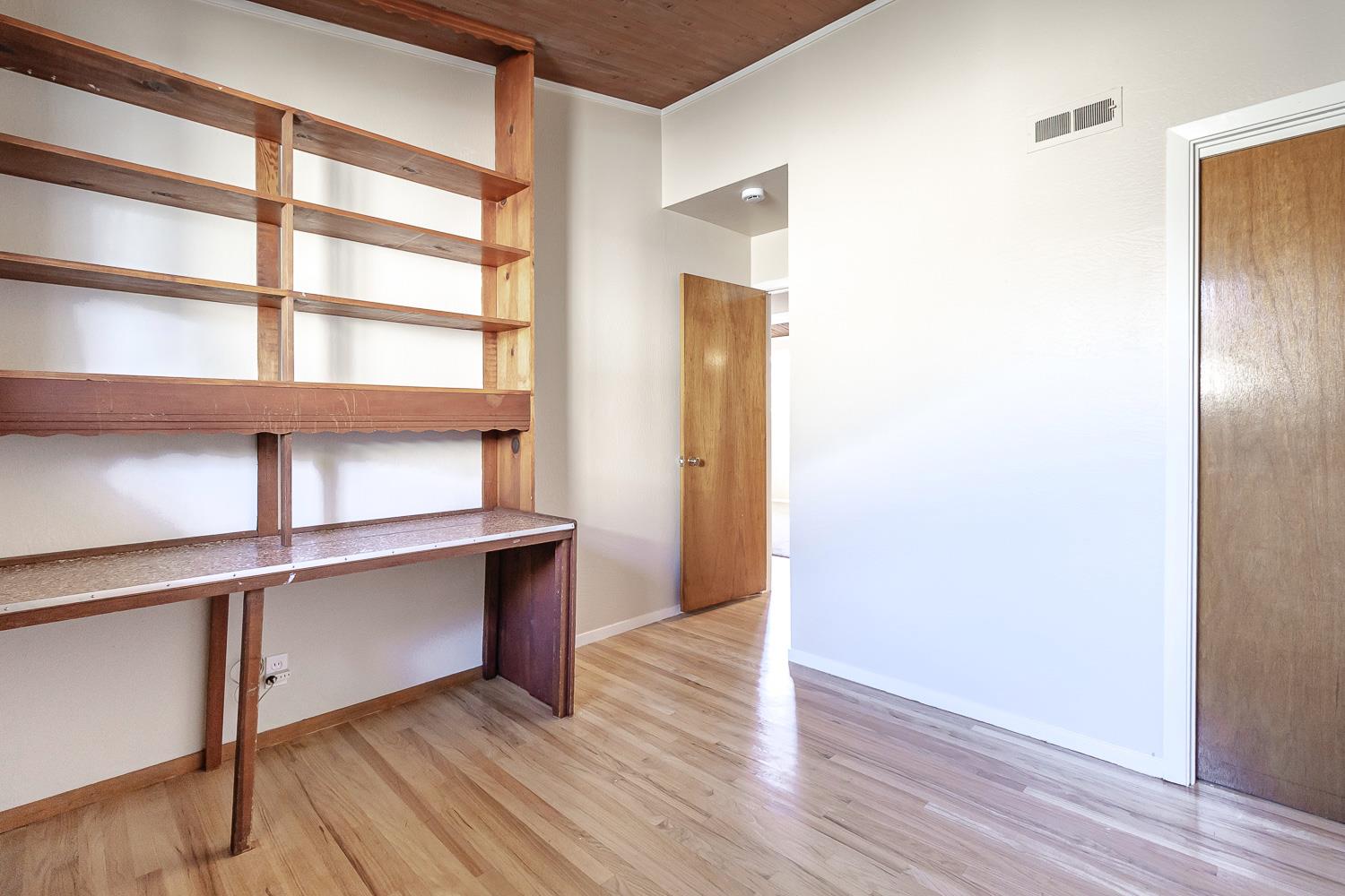 1506 Madison Avenue Tracy, CA 95376 - Photo 14 of 21 a view of an empty room with wooden floor and a window