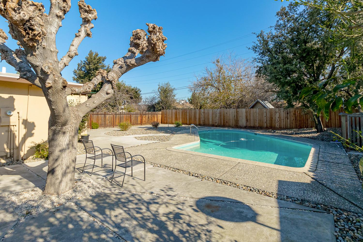1506 Madison Avenue Tracy, CA 95376 - Photo 18 of 21 a view of a backyard with a table and chair