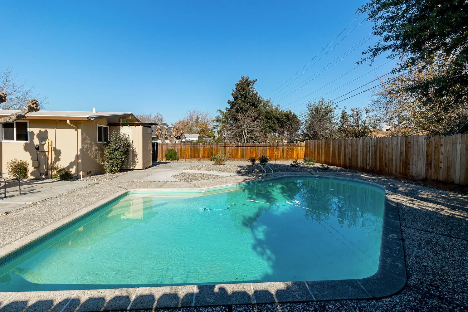 1506 Madison Avenue Tracy, CA 95376 - Photo 19 of 21 a view of a swimming pool with a yard