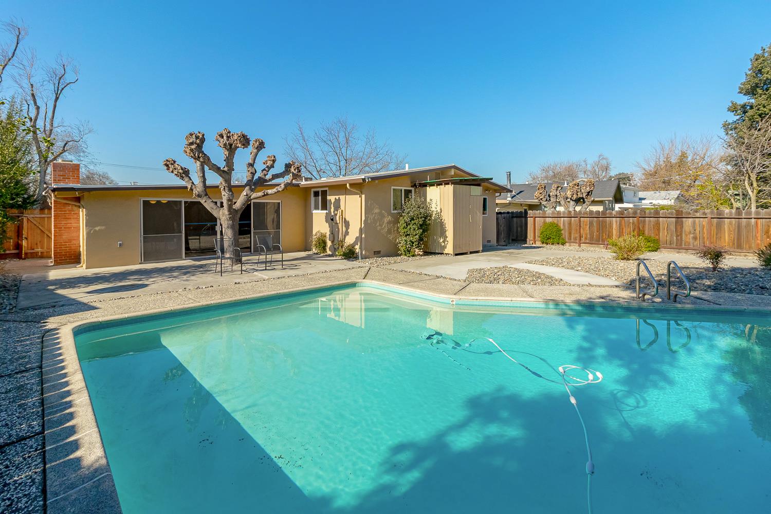 1506 Madison Avenue Tracy, CA 95376 - Photo 20 of 21 a swimming pool with outdoor seating and yard