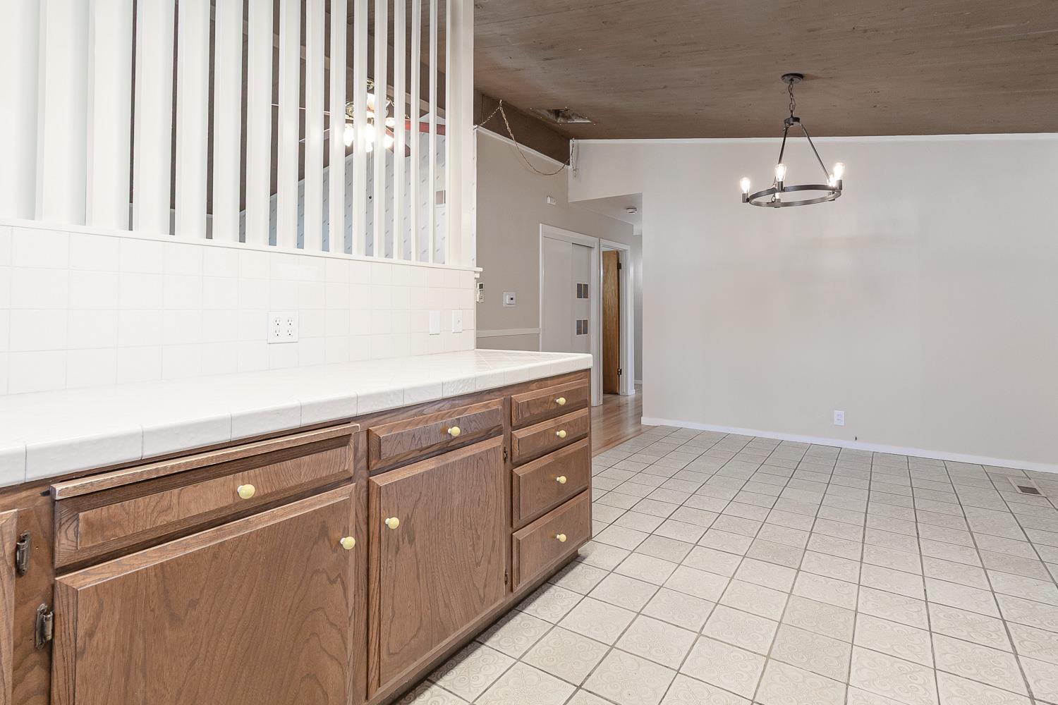 1506 Madison Avenue Tracy, CA 95376 - Photo 8 of 21 a kitchen with a sink cabinets and wooden floor