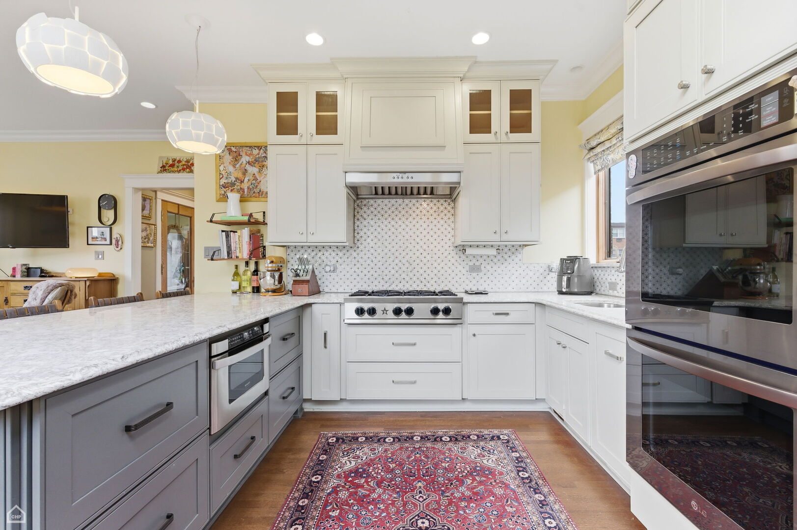 1516 West Sherwin Avenue Chicago, IL 60626 - Photo 12 of 45 a kitchen with stainless steel appliances granite countertop a stove a sink and a microwave