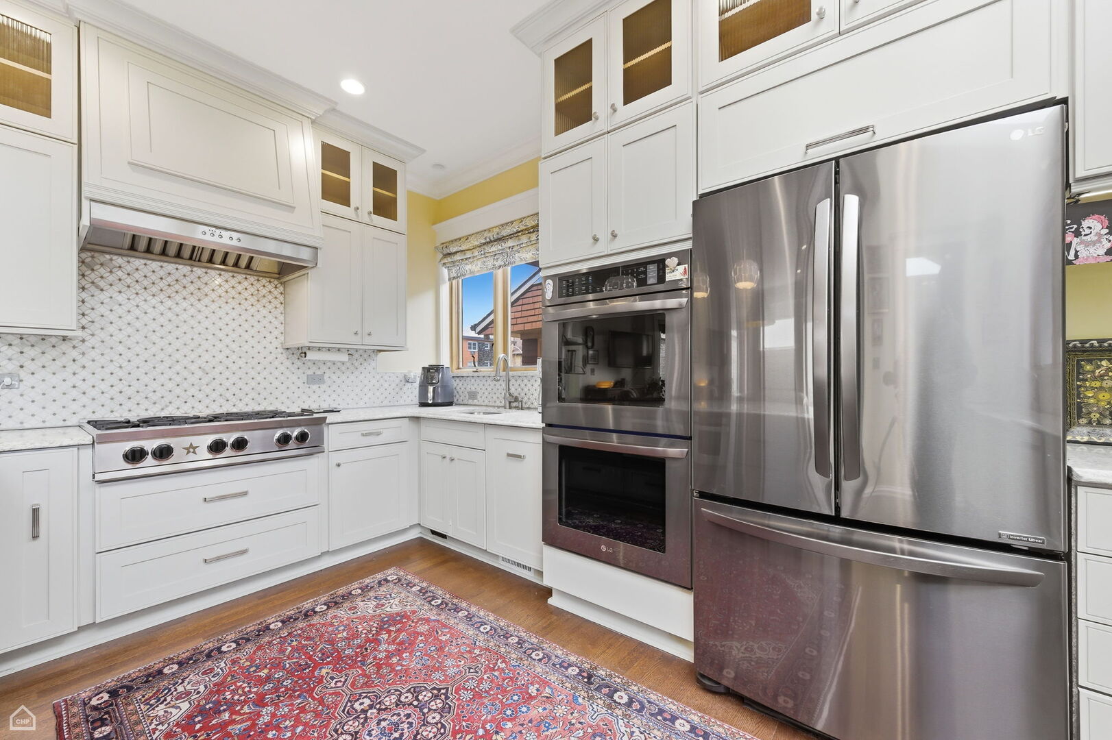 1516 West Sherwin Avenue Chicago, IL 60626 - Photo 13 of 45 a kitchen with stainless steel appliances granite countertop a refrigerator sink stove and oven