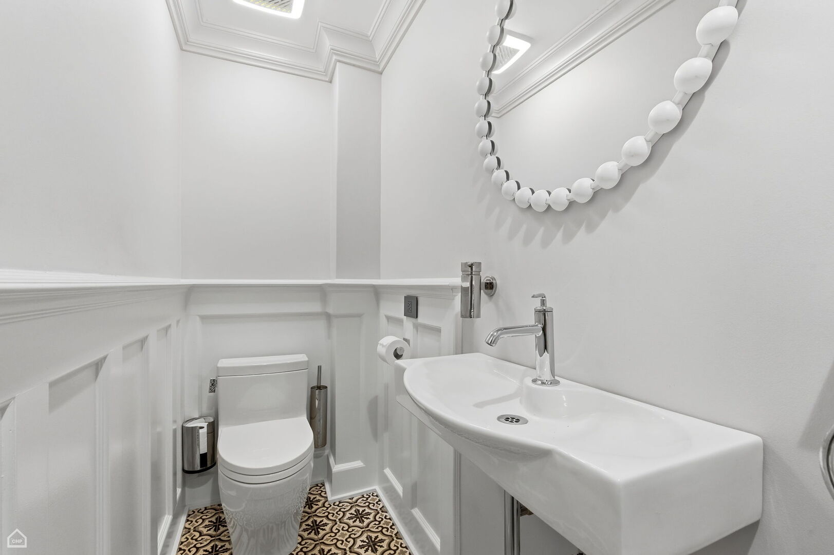 1516 West Sherwin Avenue Chicago, IL 60626 - Photo 18 of 45 a bathroom with a sink a mirror and a toilet