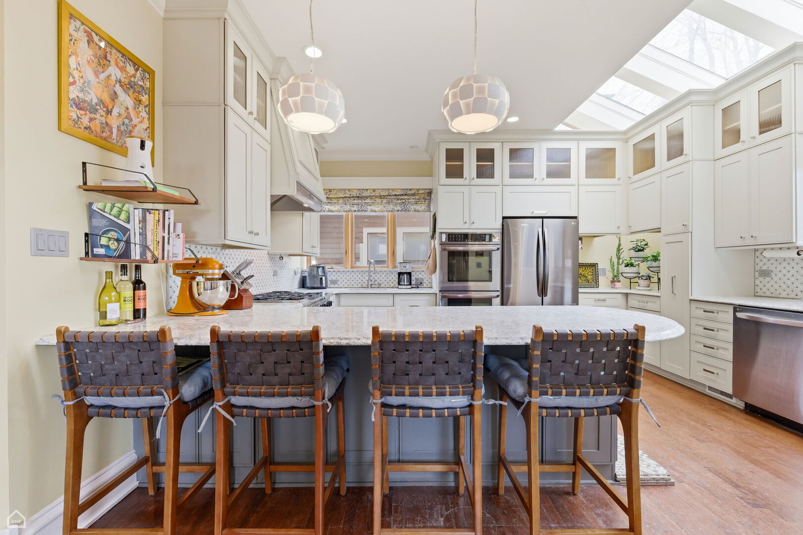 1516 West Sherwin Avenue Chicago, IL 60626 - Photo 2 of 45 a dining area with stainless steel appliances granite countertop a dining table and chairs with wooden floor