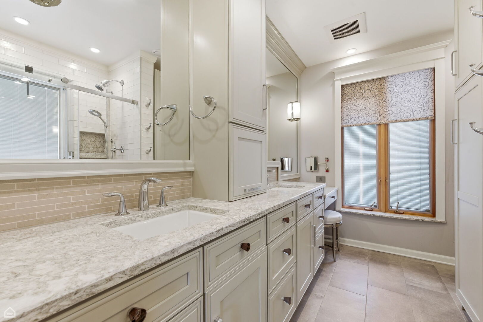 1516 West Sherwin Avenue Chicago, IL 60626 - Photo 24 of 45 a spacious bathroom with a granite countertop sink mirror and double