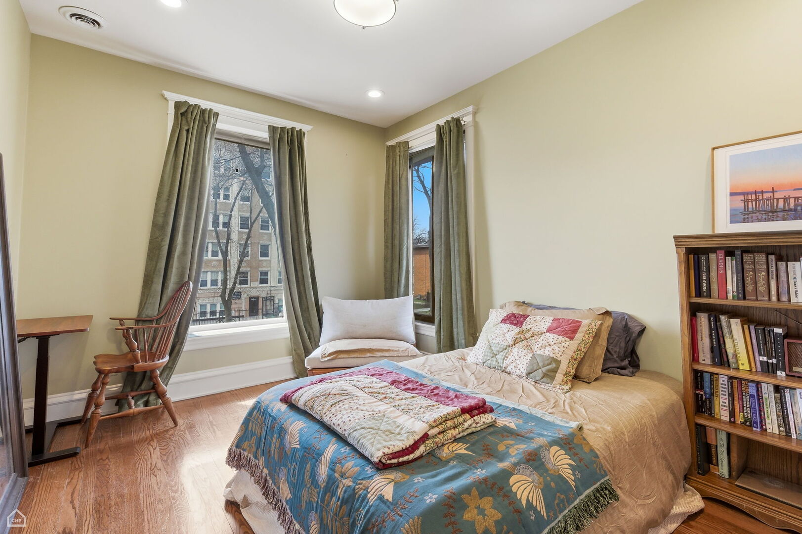 1516 West Sherwin Avenue Chicago, IL 60626 - Photo 25 of 45 a bedroom with a bed and a book shelf