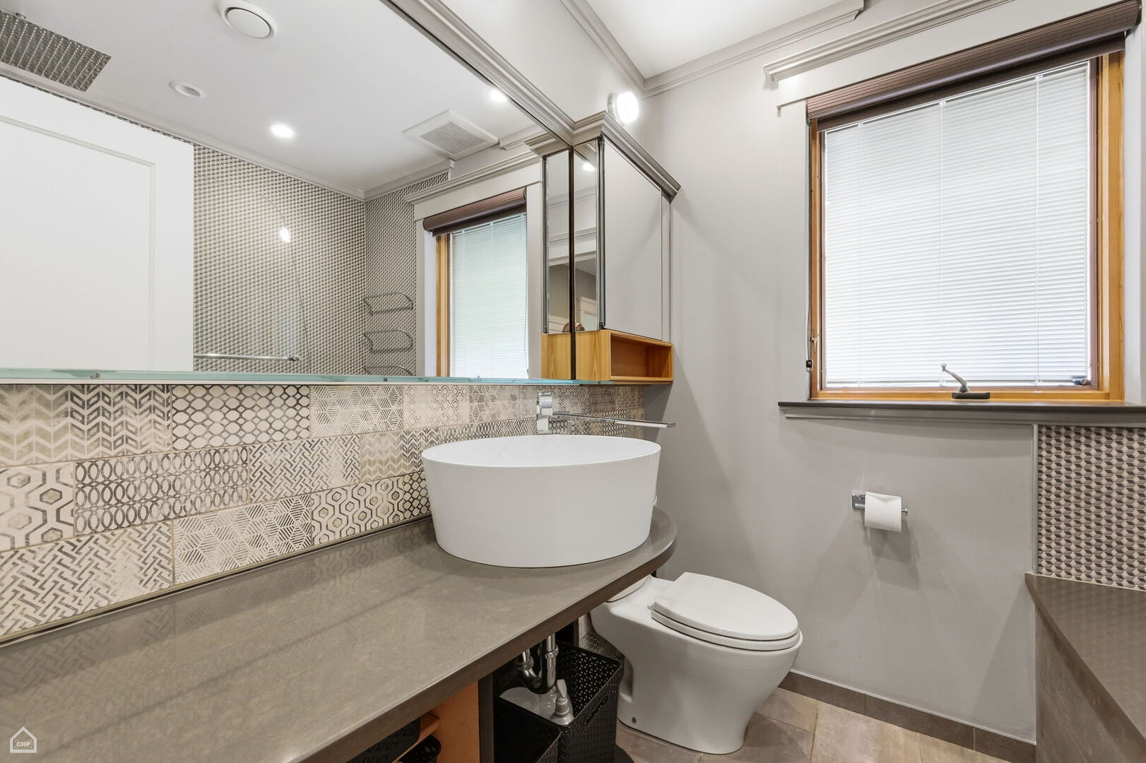 1516 West Sherwin Avenue Chicago, IL 60626 - Photo 26 of 45 a bathroom with a granite countertop sink mirror vanity and toilet